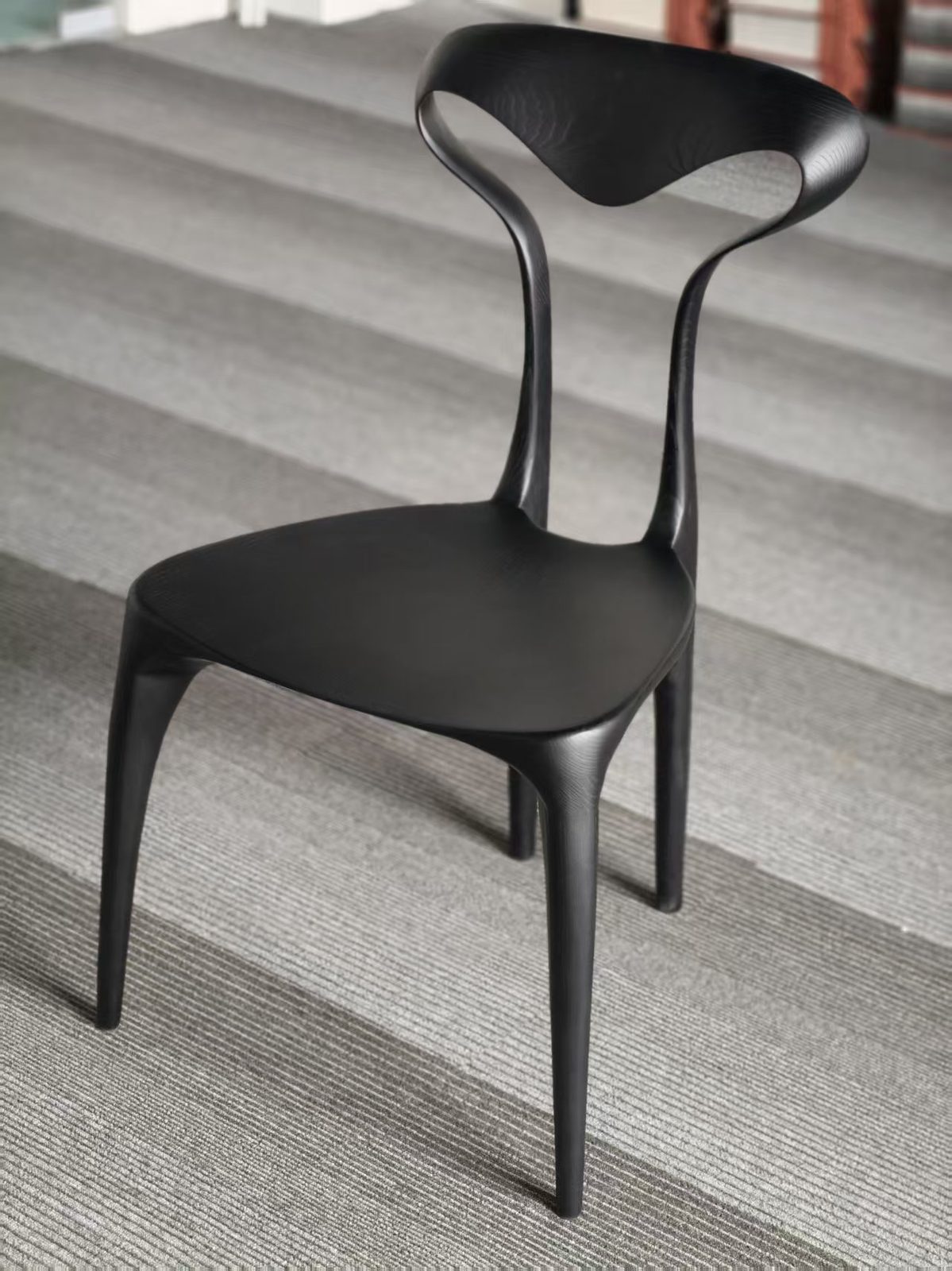 Accent dining chair with sculptural legs